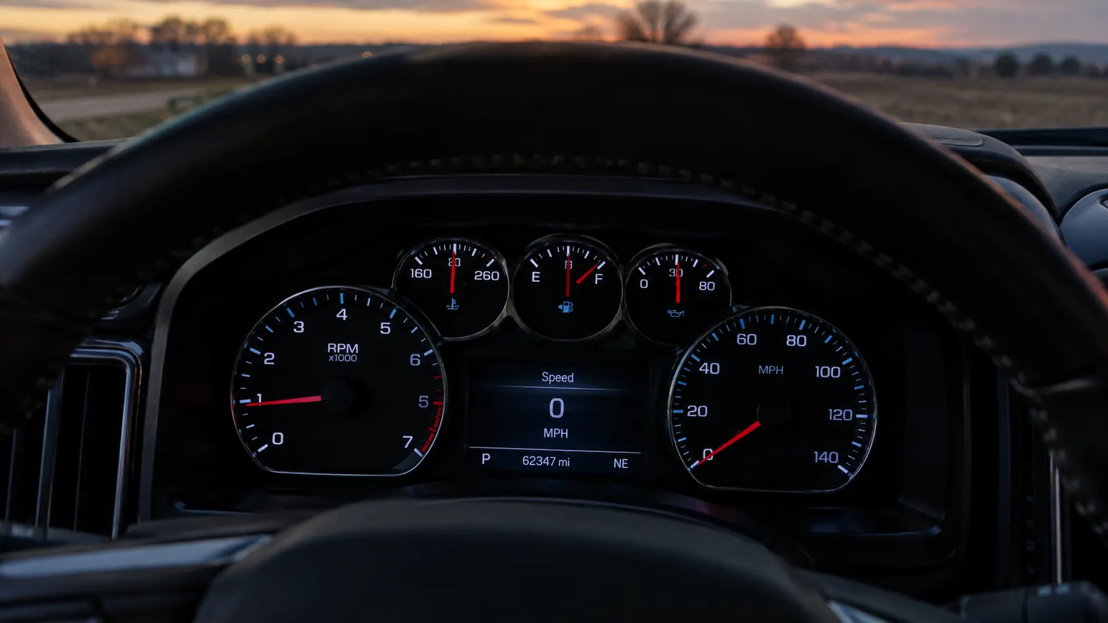 A pickup truck dashboard at dusk with no warning lights on